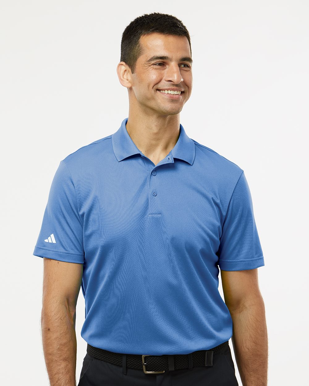 Man wearing a blue Adidas polo shirt on a white background