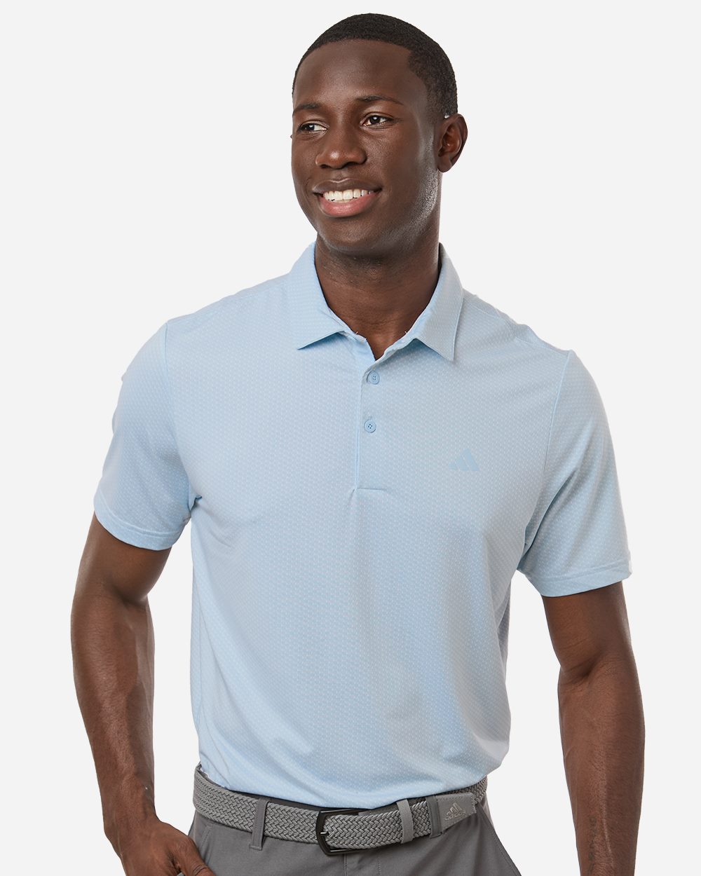 Man wearing a light blue polo shirt on a white background