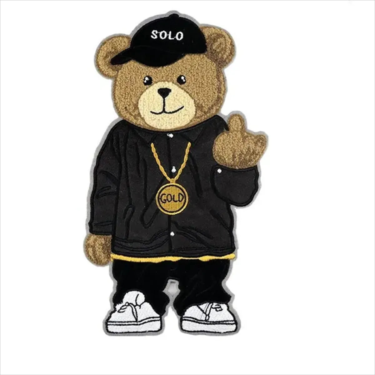 Teddy bear wearing a black outfit with 'SOLO' cap, gold chain, and white sneakers on a white background