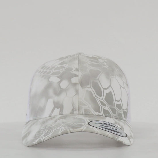 Yupoong 6606 retro trucker cap with custom embroidered logo, structured front, mesh back, and snapback closure.
